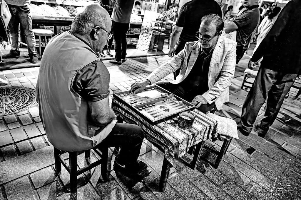 92. Two Men Play Traditional Turkish Checkers